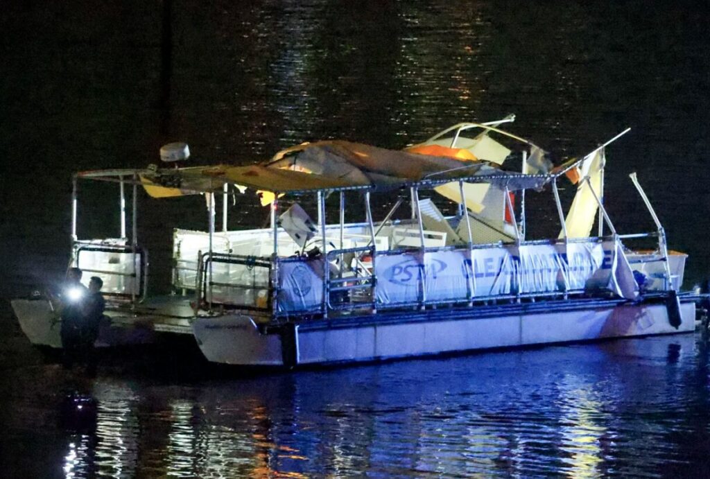 h the wreckage of a ferry after a boat crashed into it near the Clearwater Memorial Causeway Bridge.